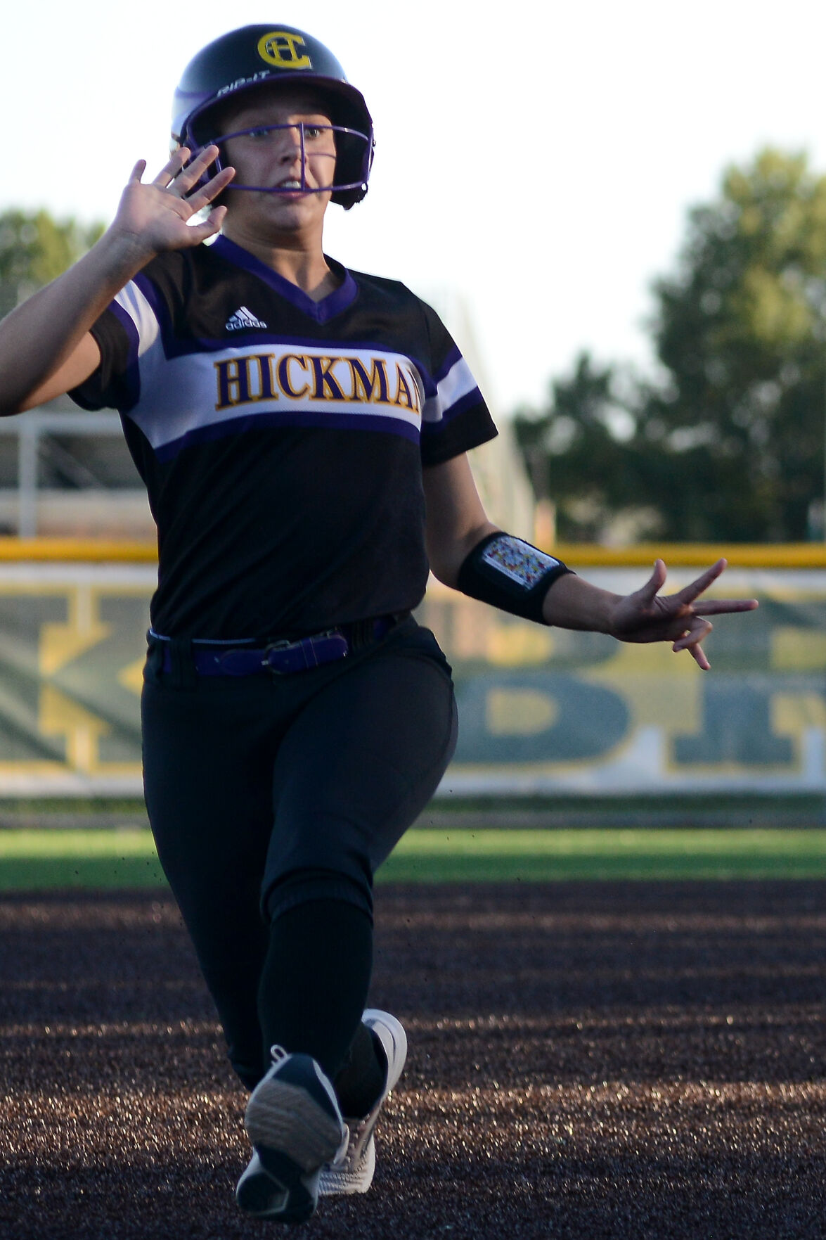 Hickman’s Bri Basye begins to slide into third